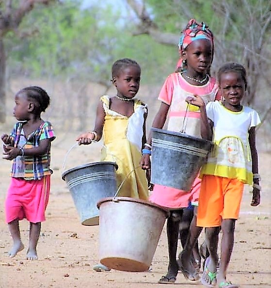 Chicldren carrying water
